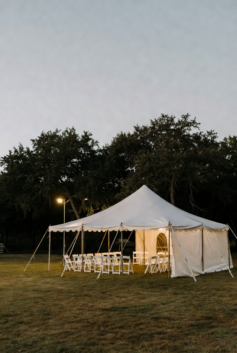 White tent with tables and chairs for outdoor events near Kyle, TX